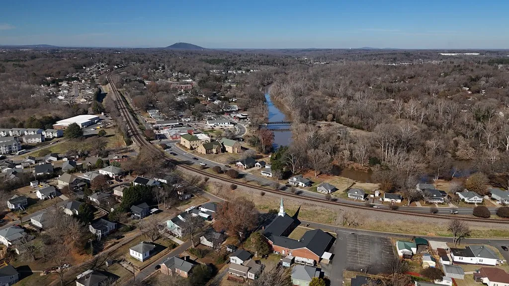 Aerial view of Cramerton with the South Fork Catawba River and the railroad