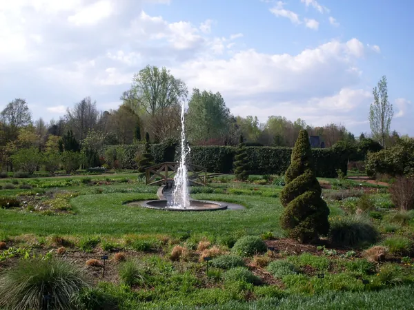 A fountain surrounded by gardens at Daniel Stowe Botanical Garden